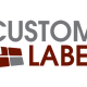 Custom label's logo, with custom spelled in grey and label spelled in red