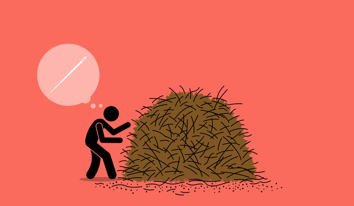 A black figure searches a haystack for a needle
