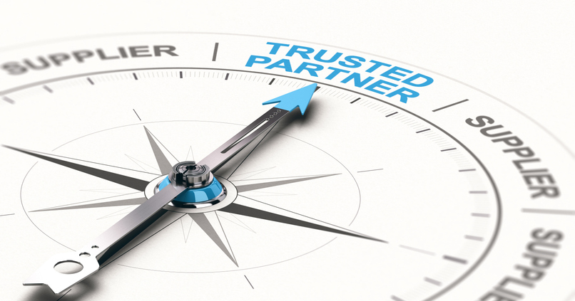 A compass is labeled with "trusted partner" and "supplier" along the rim, with the arrow pointing at trusted partner